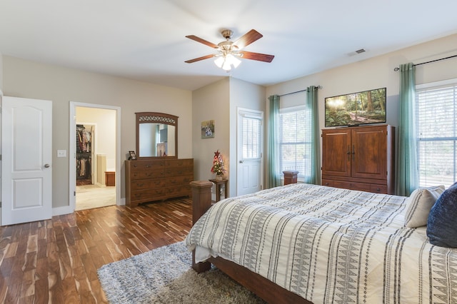 bedroom with dark wood-type flooring and ceiling fan