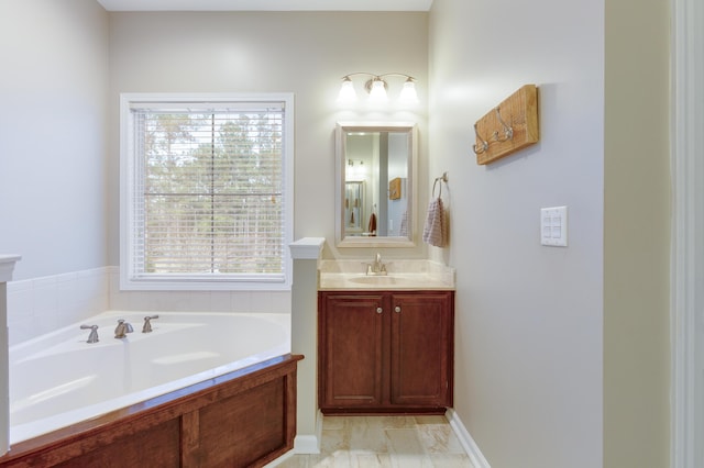 bathroom featuring vanity and a bathing tub