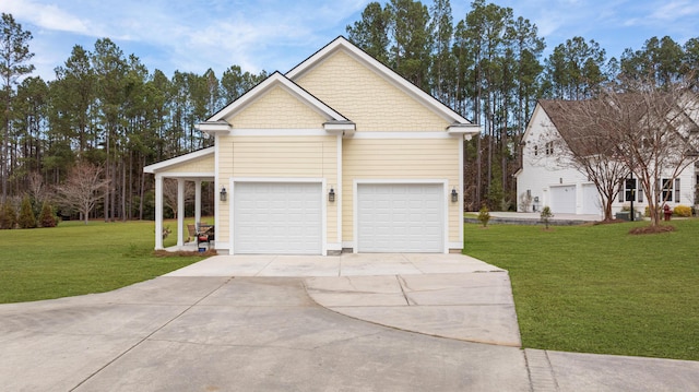 view of side of property with a garage and a yard