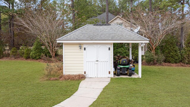 view of outbuilding with a yard