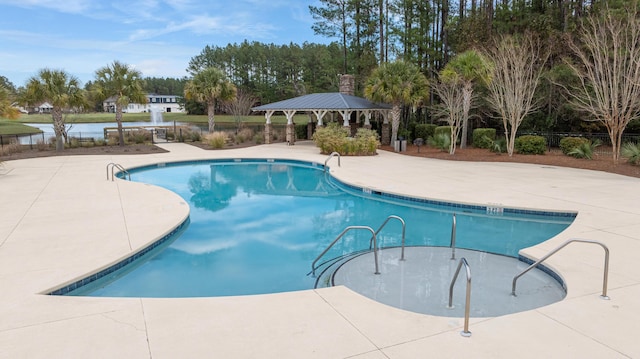 1129 Plantation Overlook Dr, Moncks Corner, SC 29461 - community pool featuring a gazebo, a patio, a water view, and view of scattered trees