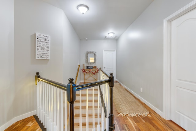 hallway with wood-type flooring