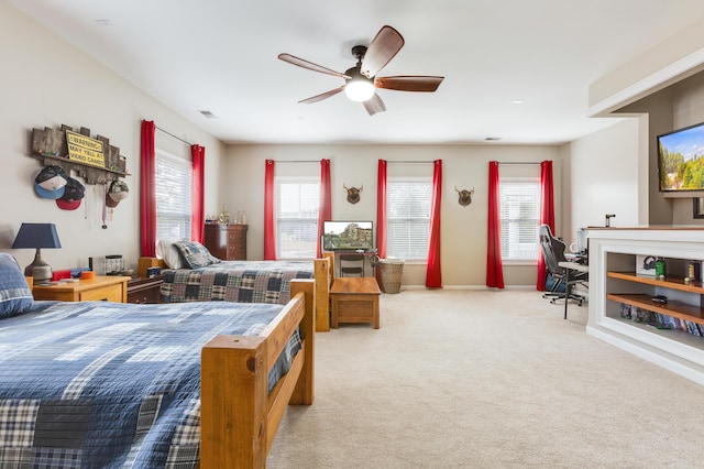 bedroom featuring light carpet and ceiling fan