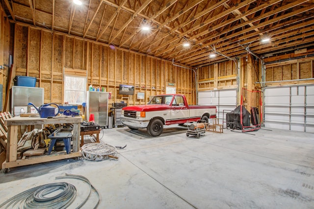 garage with a workshop area