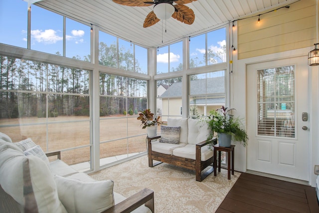 sunroom / solarium featuring wood ceiling and ceiling fan