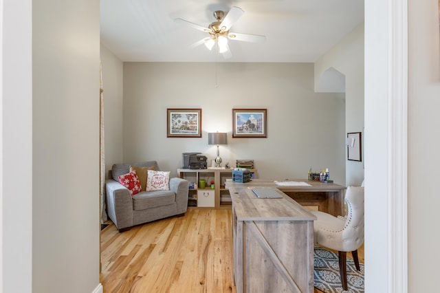 office with ceiling fan and light hardwood / wood-style flooring