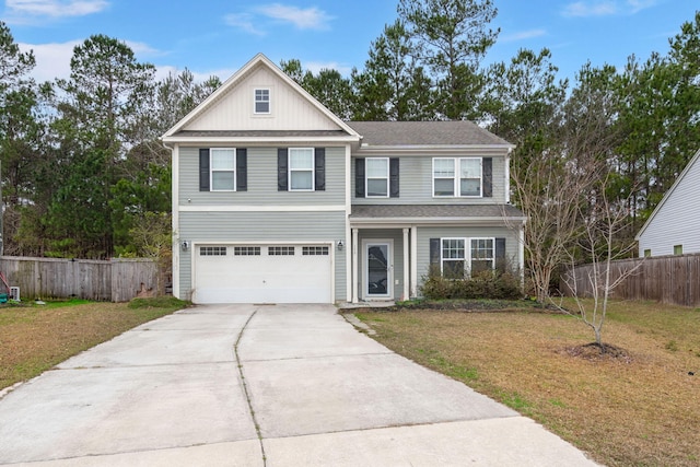 view of front of house with a garage and a front yard