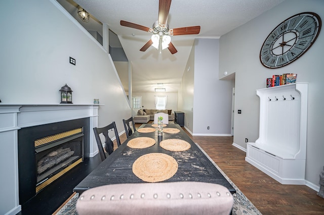 229 Lindy Creek Rd, Goose Creek, SC 29445 - dining area featuring ceiling fan, a fireplace, wood finished floors, and high vaulted ceiling