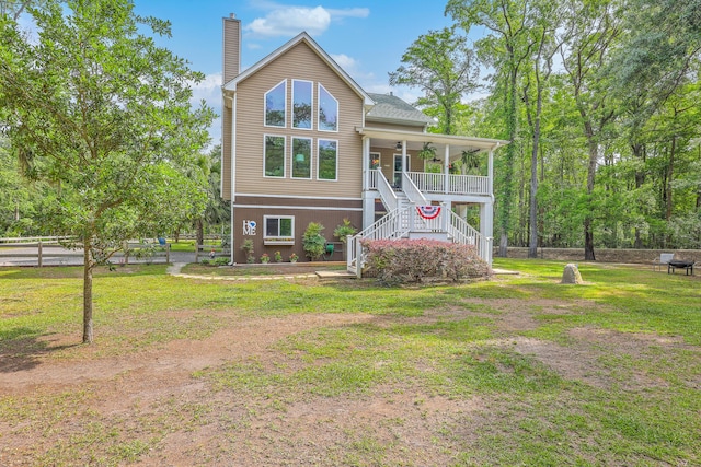 100 Canal Rd, Saint George, SC 29477 - view of front of property featuring stairway, a chimney, covered porch, and ceiling fan