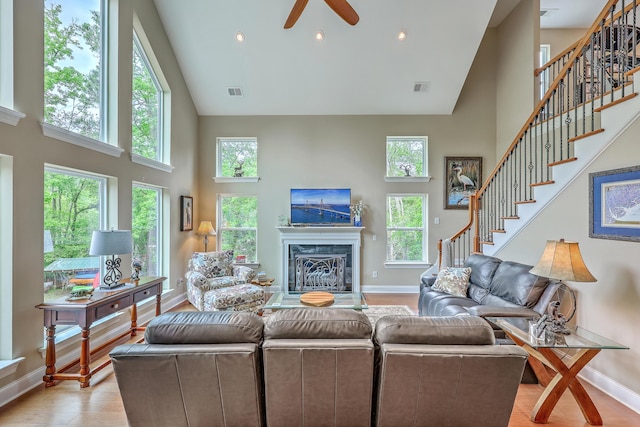 100 Canal Rd, Saint George, SC 29477 - living area featuring high vaulted ceiling, baseboards, a premium fireplace, ceiling fan, and stairway