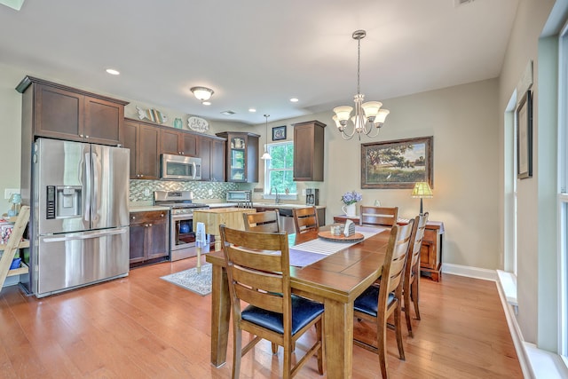 100 Canal Rd, Saint George, SC 29477 - dining area with light wood-type flooring, a chandelier, recessed lighting, and baseboards