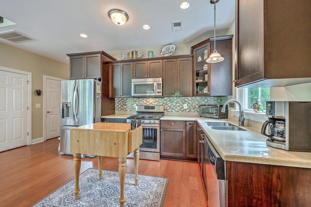 100 Canal Rd, Saint George, SC 29477 - kitchen featuring stainless steel appliances, a sink, light wood-style flooring, light countertops, and recessed lighting