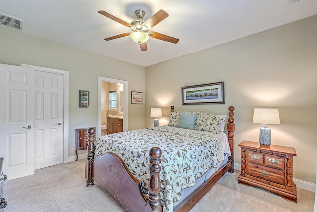 100 Canal Rd, Saint George, SC 29477 - carpeted bedroom with baseboards, ensuite bath, ceiling fan, and a closet