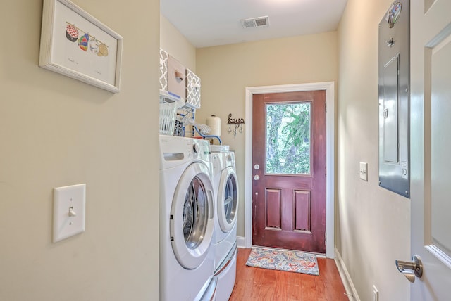 100 Canal Rd, Saint George, SC 29477 - laundry room featuring washer and clothes dryer, light wood finished floors, and baseboards