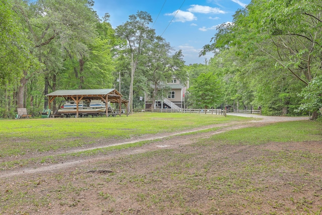 100 Canal Rd, Saint George, SC 29477 - view of green lawn with a carport, stairway, and a view of trees