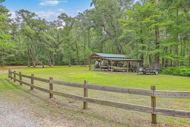 100 Canal Rd, Saint George, SC 29477 - view of yard featuring a detached carport and a view of trees