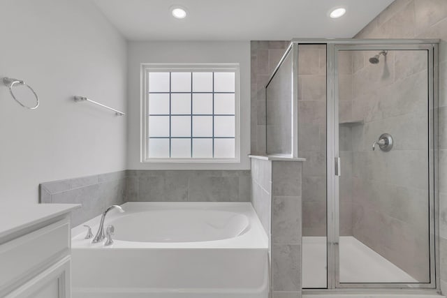9998 Winged Elm St, Ladson, SC 29456 - full bathroom featuring a shower stall, a garden tub, vanity, and recessed lighting