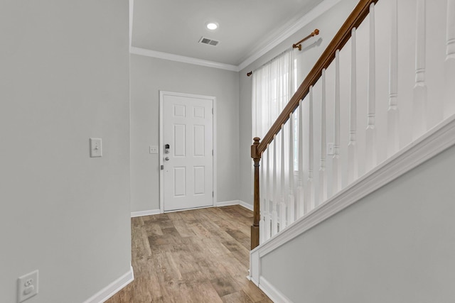 9998 Winged Elm St, Ladson, SC 29456 - foyer with ornamental molding, baseboards, stairs, wood finished floors, and recessed lighting