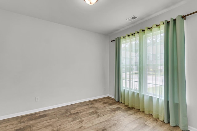 9998 Winged Elm St, Ladson, SC 29456 - unfurnished room featuring light wood-type flooring, plenty of natural light, and baseboards