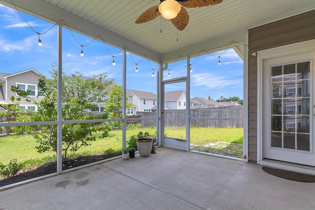 9998 Winged Elm St, Ladson, SC 29456 - unfurnished sunroom with a residential view and ceiling fan