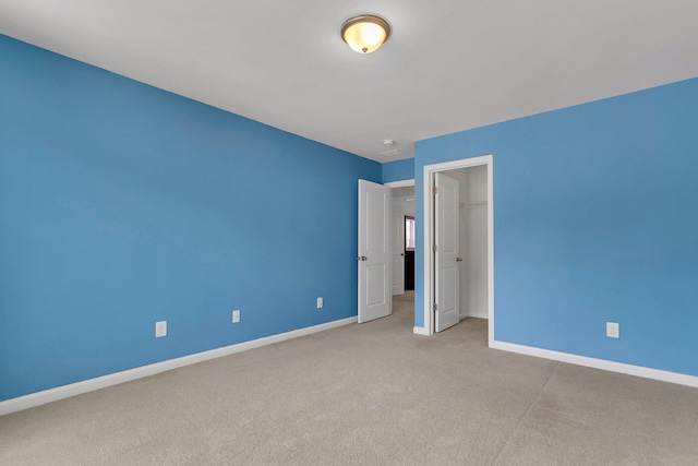 9998 Winged Elm St, Ladson, SC 29456 - unfurnished bedroom featuring carpet, baseboards, a closet, and a spacious closet