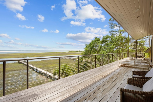 wooden deck featuring a water view