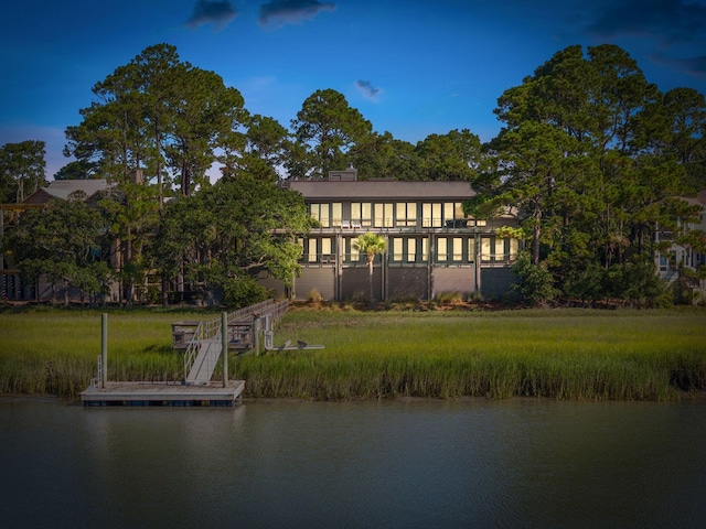 back of house with a water view