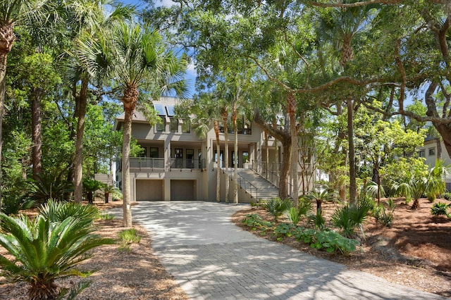 view of front of property featuring covered porch and a garage