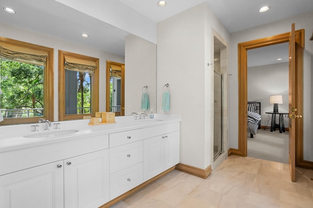 bathroom with vanity and an enclosed shower