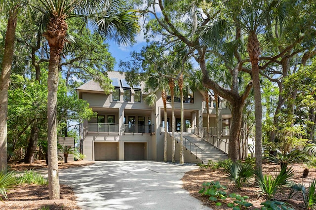 view of front of property featuring covered porch and a garage