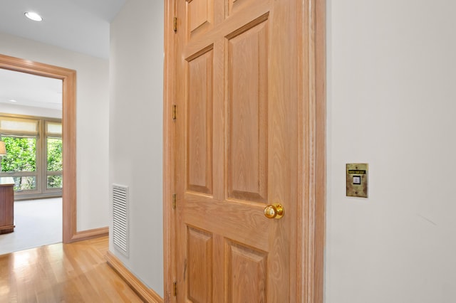 corridor featuring light hardwood / wood-style flooring