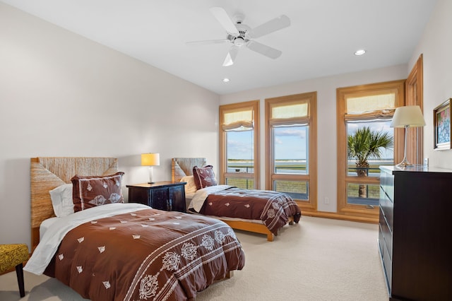 carpeted bedroom with ceiling fan