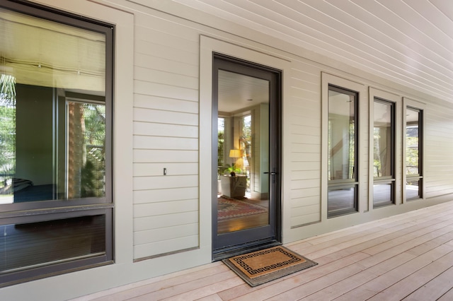 view of exterior entry featuring a porch