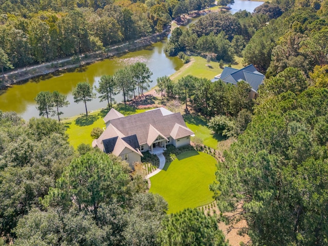 bird's eye view with a water view and a view of trees