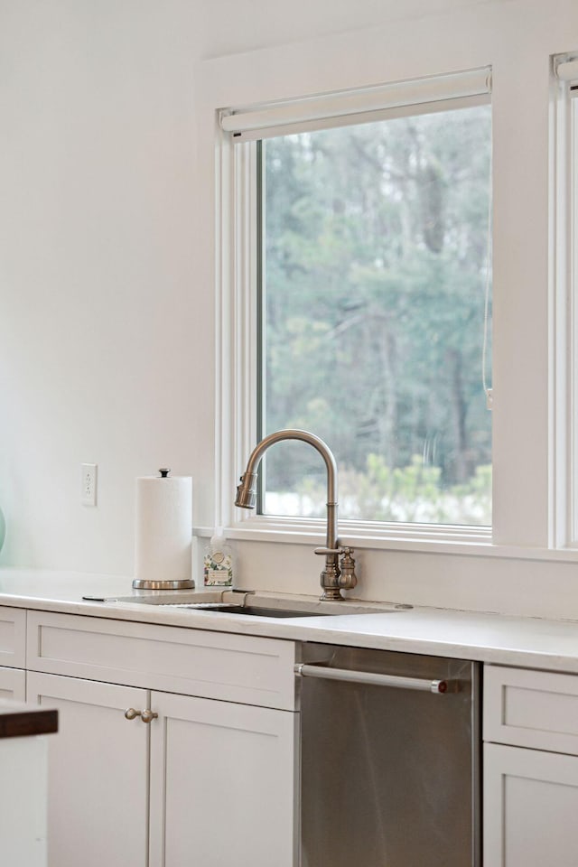 room details featuring a sink and dishwasher