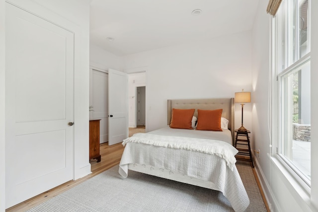 bedroom featuring wood finished floors