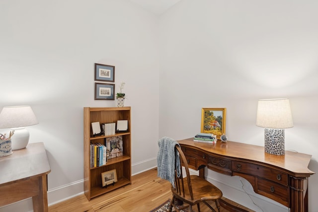 office space featuring light wood-style floors and baseboards