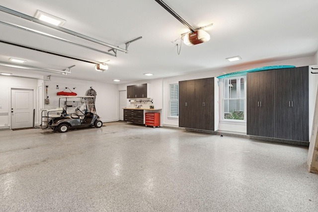 garage featuring a garage door opener