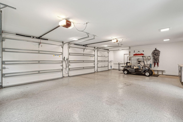 garage featuring a garage door opener