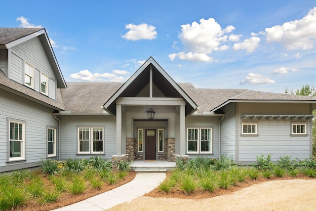 view of front facade featuring a shingled roof