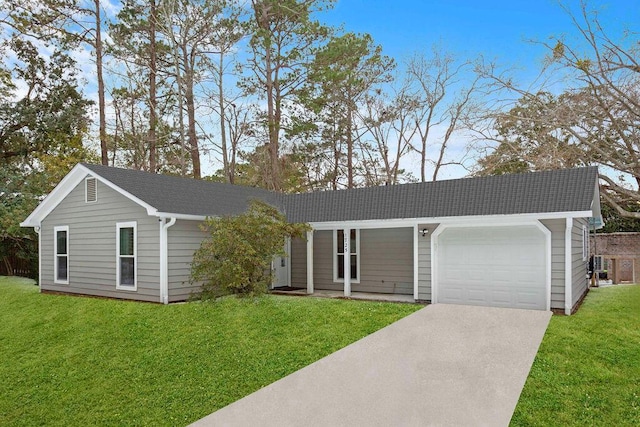 ranch-style home with a garage and a front lawn