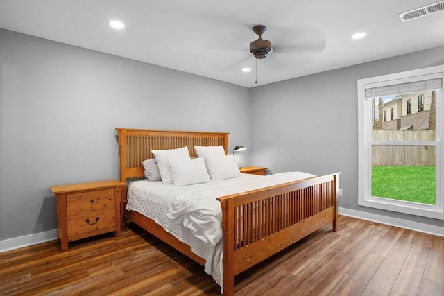 bedroom featuring wood-type flooring and ceiling fan