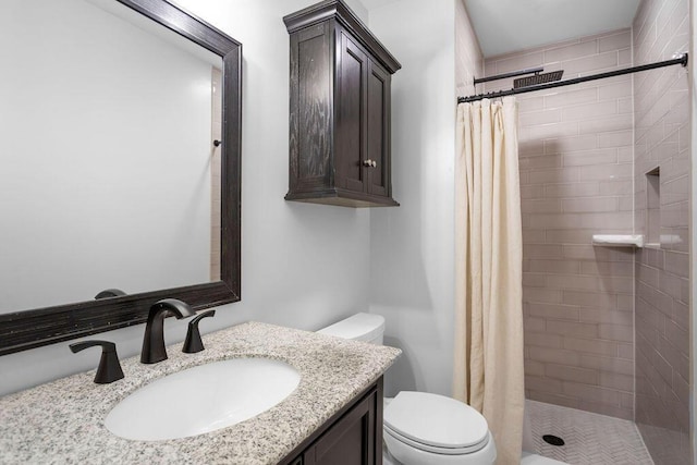 bathroom with vanity, curtained shower, and toilet