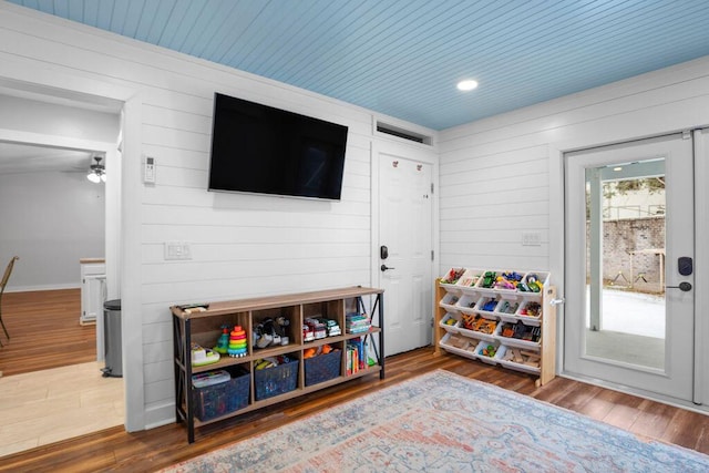 recreation room featuring hardwood / wood-style floors and wooden ceiling