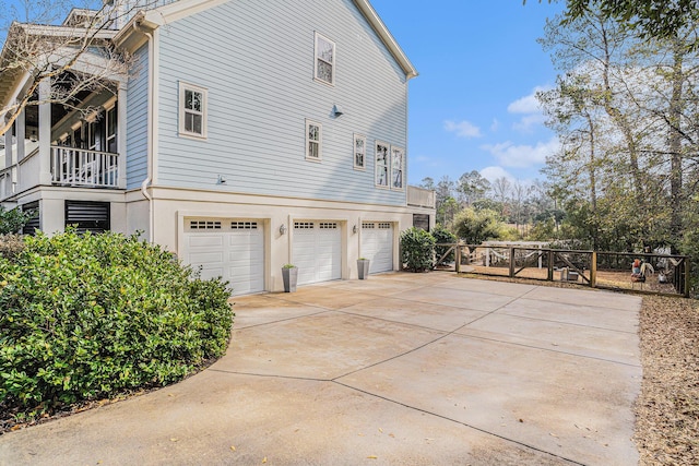 view of side of property with a garage