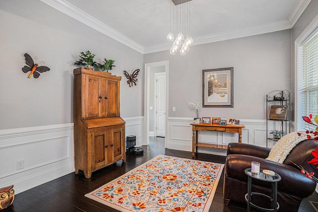 sitting room with crown molding and dark hardwood / wood-style floors