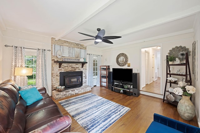 living room featuring a ceiling fan, beam ceiling, and wood finished floors