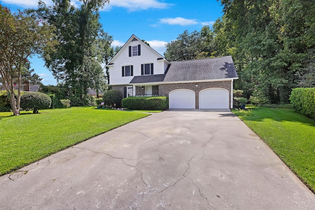 view of front of property featuring a front yard, an attached garage, brick siding, and concrete driveway