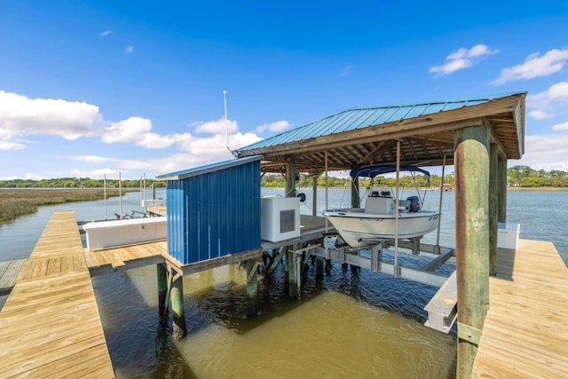 view of dock featuring a water view and boat lift