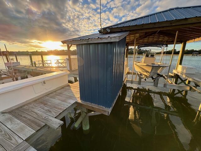 view of dock featuring a water view and boat lift